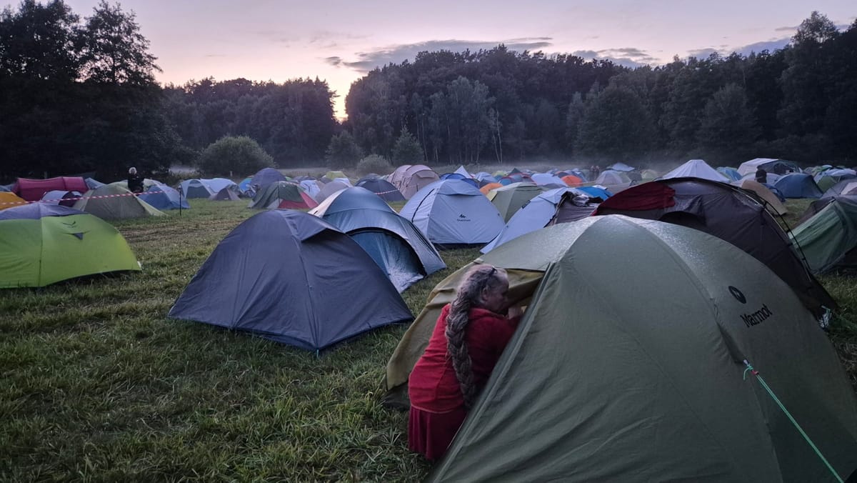Peaceful tents in a foggy field.